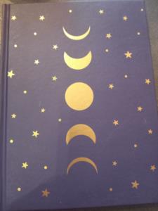 Quaderno blu con fasi lunari