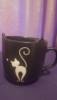 Tazza nera con gatto