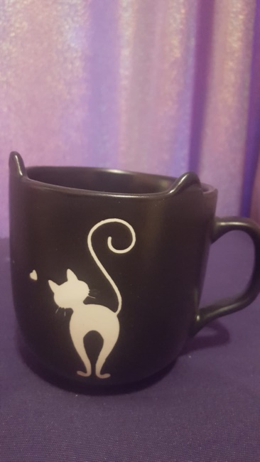 Tazza nera con gatto